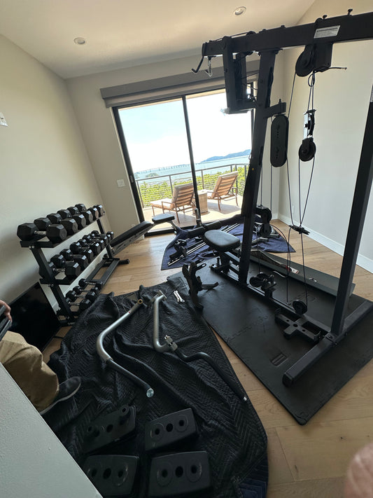 Certified technician performing gym equipment repair to restore functionality. 15