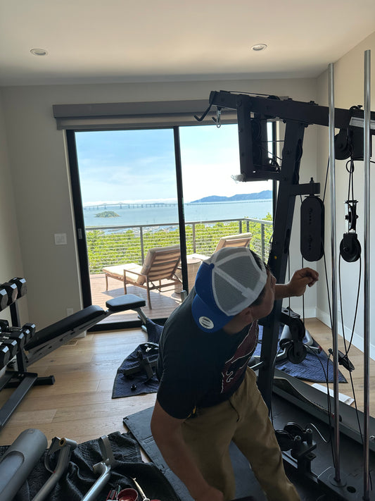 Technician providing treadmill service to enhance performance and safety. 8